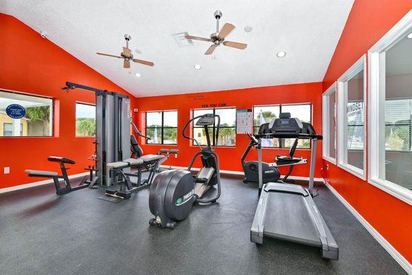 Fitness center with a treadmill, elliptical, and machine weights