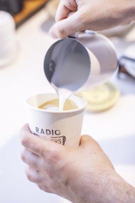 Pouring milk for a cap to remember