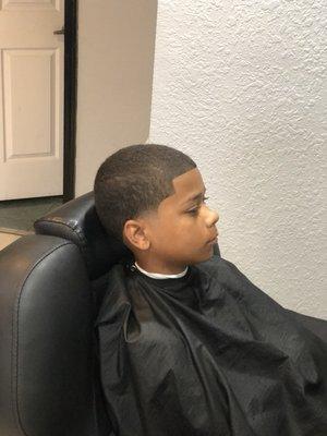 A all even Haircut with a ball Tim on the side