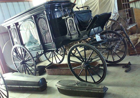 Late 1800's horse-drawn hearse, with coffins