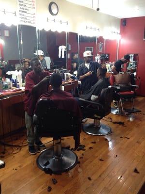 Barbers hard at work!!' Jah and Cuts!!