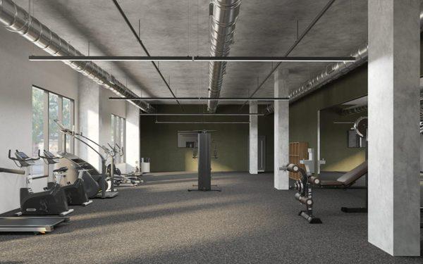 Fitness center with cardio machines and free weights.