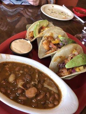 Omg those charro beans!!!! THE BEST - shrimp tacos in back