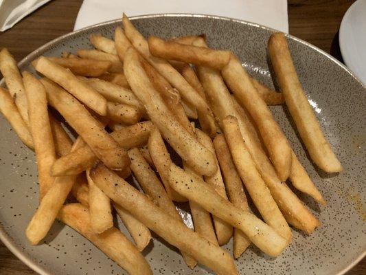 Basket of overcooked fries ordered as an appetizer.