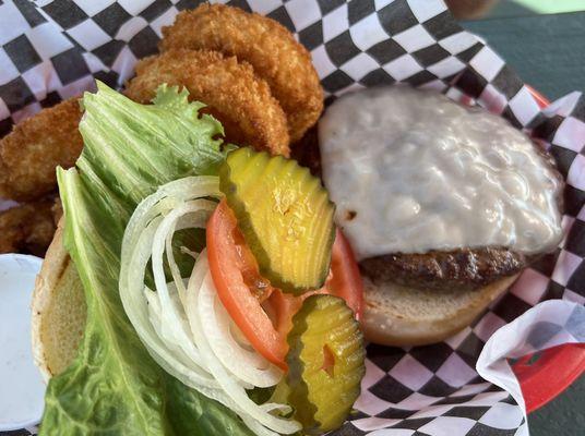 Alcan burger with Swiss cheese, and onion rings.