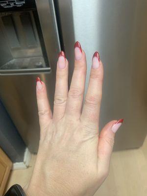 Beautiful red glitter French tip extensions . Sorry my middle finger is crooked- it's my finger, not the extensions!