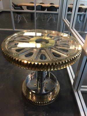 Coffee table polished out elevator gears.