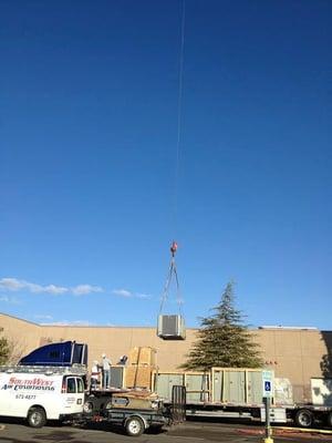 Crane setting equipment at the Red Cliffs Mall, St George, UT.