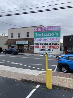 Parking lot entrance across street from restaurant