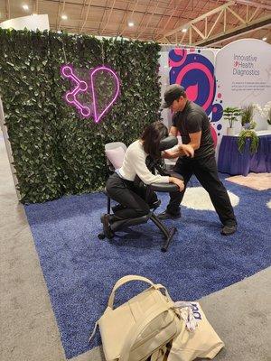 Chair massage at fertility convention.