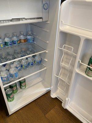 Fridge in waiting room with water and ginger ale