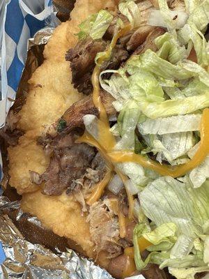 Close-up of the frybread and the chicken carnitas.