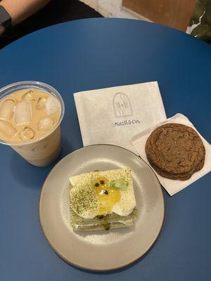 Iced Rose Latte (left), Matcha passion Blossom cake (middle), and signature cookie (right)