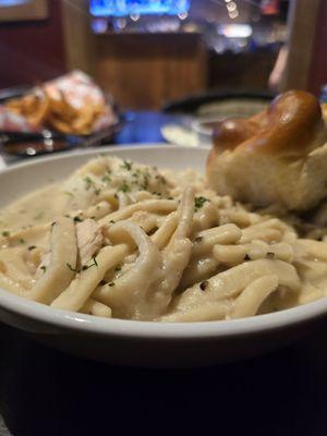 Chicken noodles with mashed potatoes and a roll