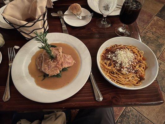 Veal Saltimbocca over spinach with spaghetti meat sauce on the side. Consistently delicious!