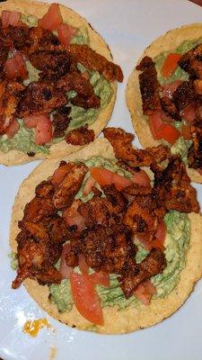 Tostadas made with carne enchilada, guacamole, and tomatoes only.