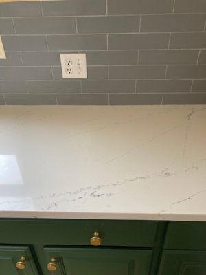 Section of new countertop and backsplash