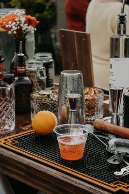 A peek behind the bar at our workstation! We also offer intimate one-on-one mixology sessions for a personalized cocktail experience.