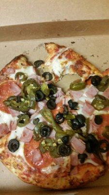 Personal Pizza with pepporoni, ham, olives and jalapenos. Was made to order and quick. I liked the taste and was cheesy.