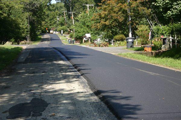 One side of the road paved. The other side waiting to be done.