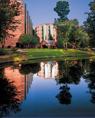 CHRSITUS St. Michael reflected in campus lake