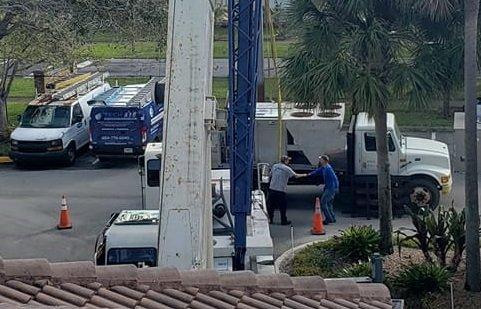 Bernie greeting the crane operator for another large packaged unit rooftop install by Tech Air