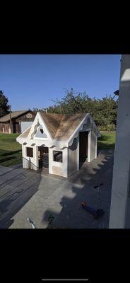 Custom pool equipment shed being built to look like a playhouse.