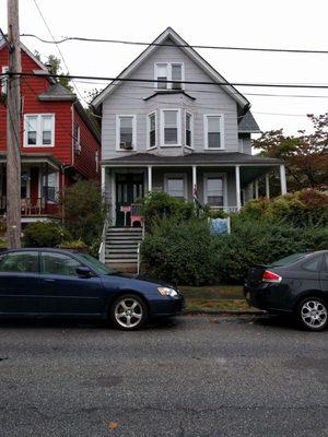 the front of the building. NOTE: the actual entrance is on the porch around the corner