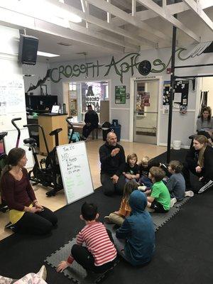 Coach Carrie & Zac breaking down the movements in our CrossFit Kids class