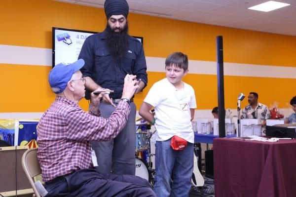 Performing Magic for Volunteers at the Second Harvest Food Bank