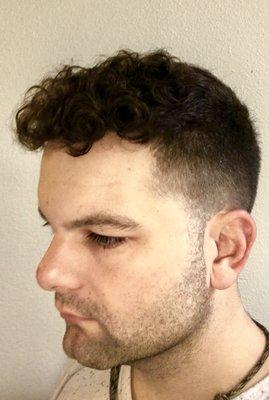 Low taper fade curly fringe