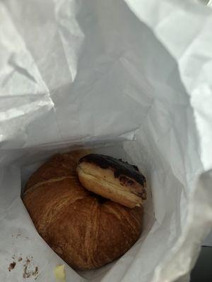 A croissant and a Boston creme filled yummy donut