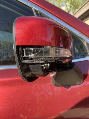 Broken underside of side view mirror