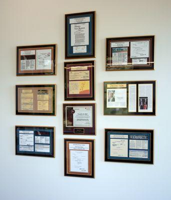 Awards & case results displayed inside office.