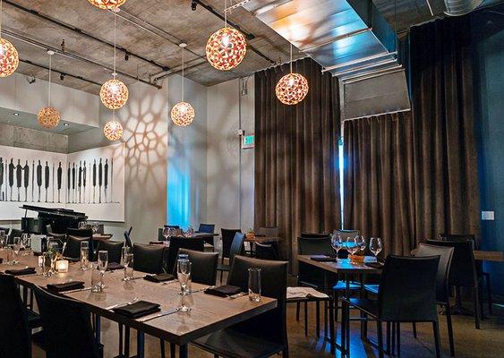 Ripple fold drapes provide form and function to this upmarket restaurant.