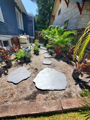 Placing our Flagstone steps and staging plants