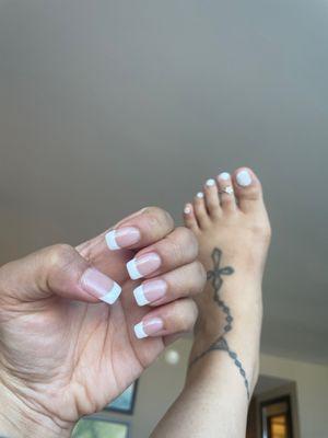 My natural look acrylic full set by Kim. Don't mind my foot! Lol