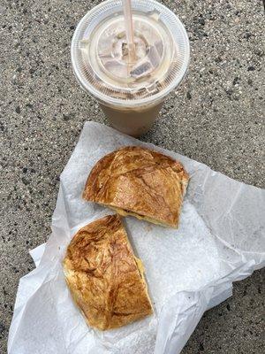 caramel iced coffee and breakfast combination croissant with bacon, ham, egg, & cheese