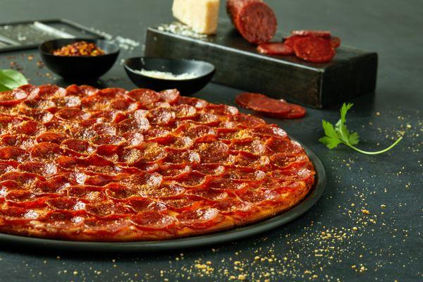 100 pieces of pepperoni on every large thin crust Pepperoni Pizza!