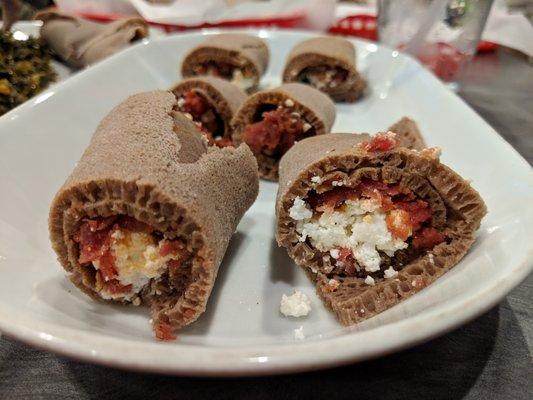 Regular kitfo. Raw ground beef with herbal butter, mitmita, and Abol seasonings served with cottage cheese. $12.99.