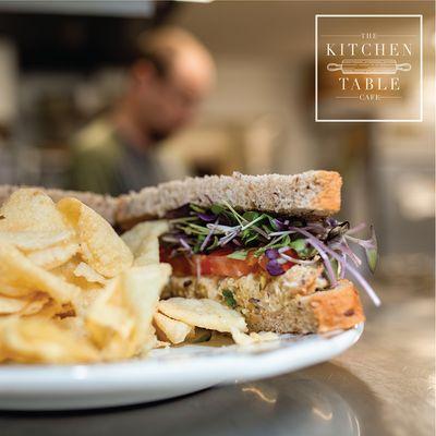 Delicious Vegan Sandwich with a side of potato chips.