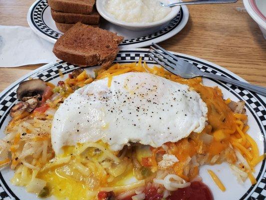 Hash brown skillet with wheat toast, grits. They give a lot of food and it was delicous. I came back today and tried the veggie omelets .