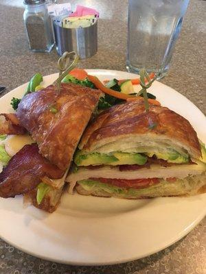 Turkey Croissant sandwich with steamed veggie side