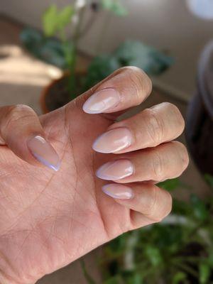 Full set: almond nails with natural color and a thin lilac design.