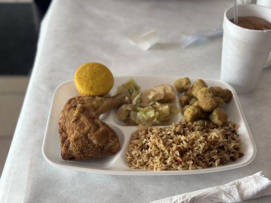 Fried chicken entrée with three sides: dirty rice, fried okra, and cabbage plus it came with the cornbread.