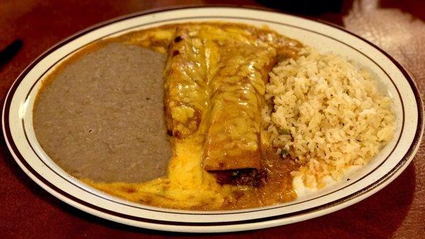 Bravo hot portion of the meal. Tamale and ground beef enchilada with beans and savory rice.