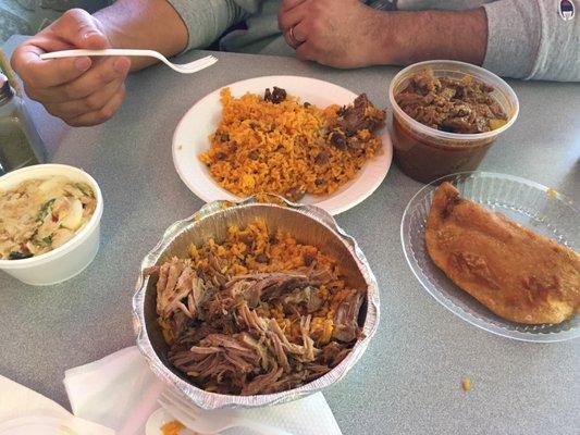 Yellow rice, slow cooked pulled pork, stewed skirt steak, cod salad & cheese empanada. So delicious.