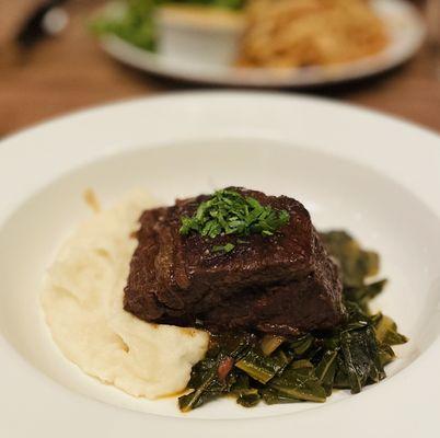 Beef with mashed potatoes and greens