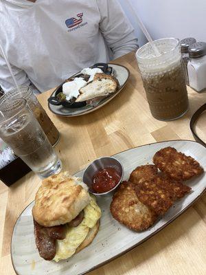 Short rib hash and sausage, egg, and cheese biscuit with hot honey and hash browns