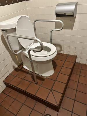 Commode in the women's bathroom.